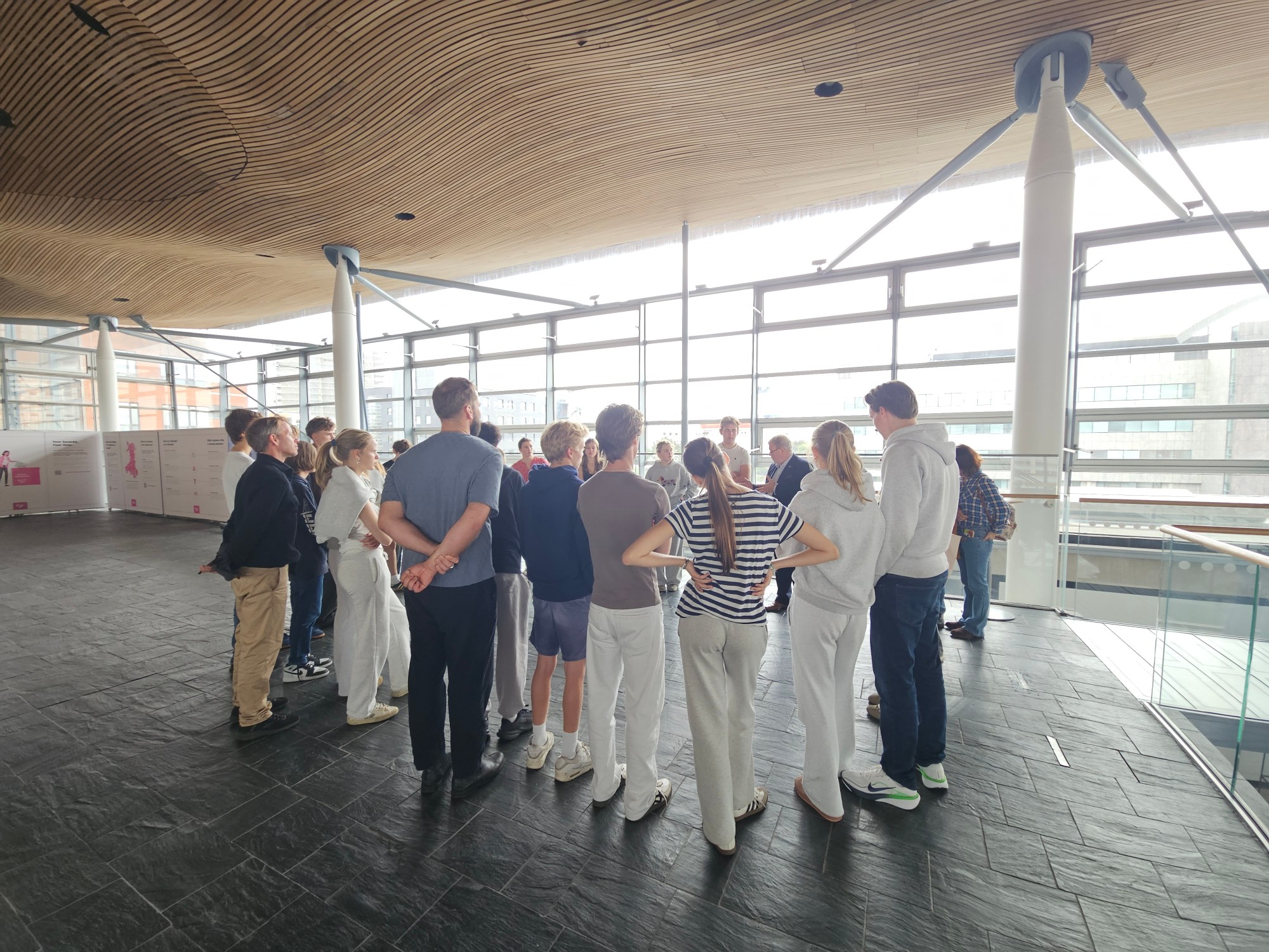 Mark Hinge of WNS introduces the Senedd to the visitors